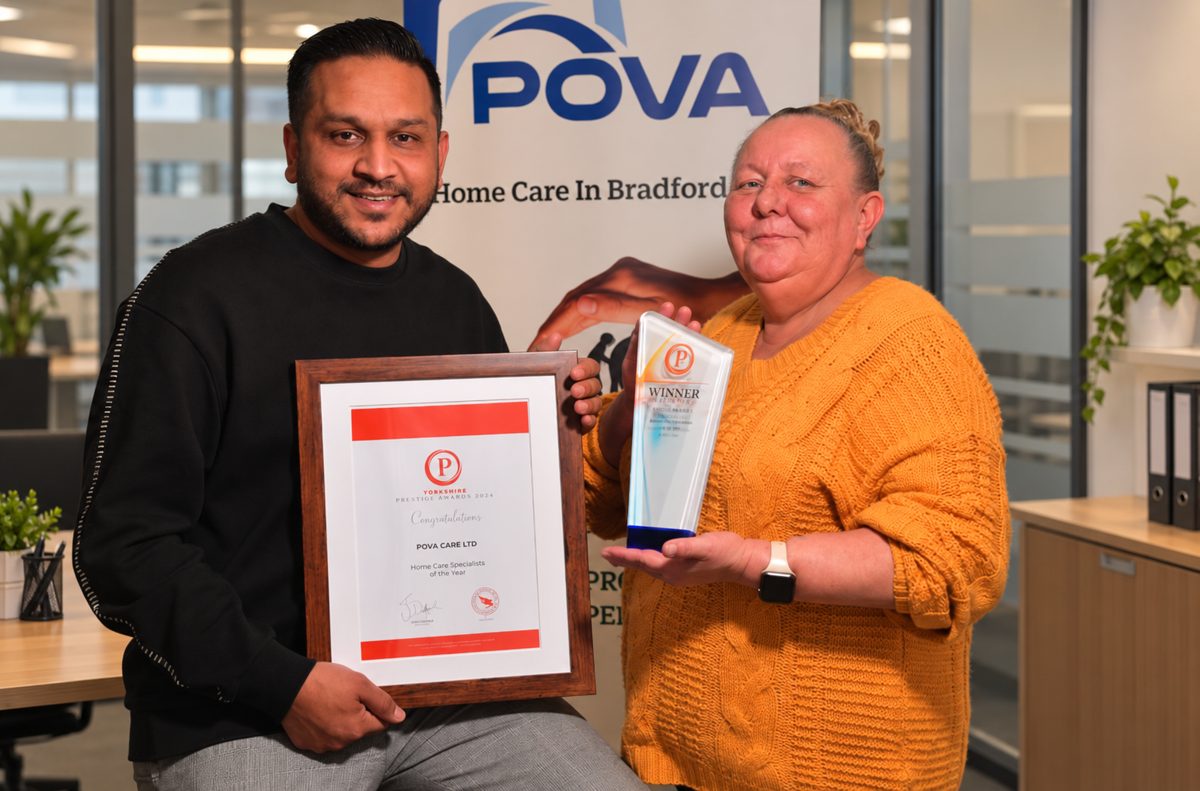 The POVA Care team holding the Yorkshire Prestige Awards trophy and certificate for Home Care Specialists of the Year
