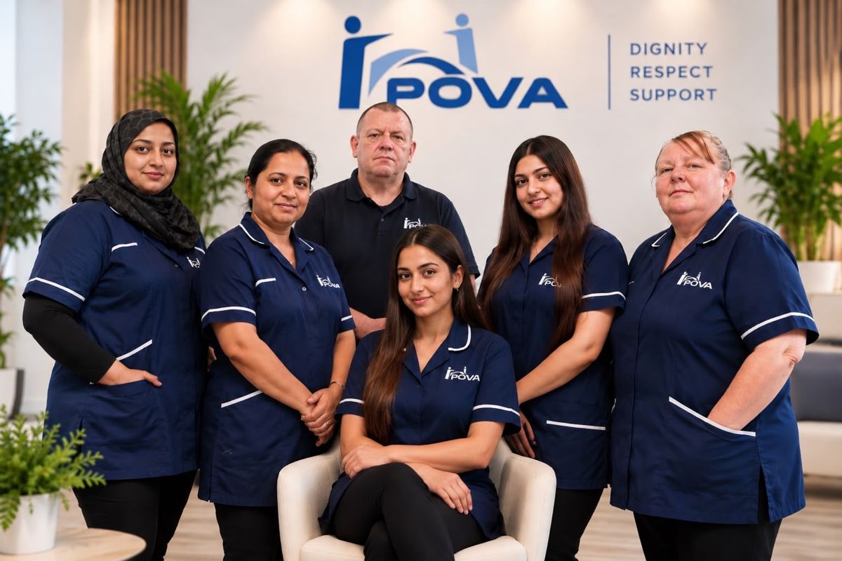 The POVA Care team in uniform in front of the POVA logo